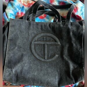 Authentic medium black denim first release comes with tags NO DUSTBAG